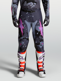 Alpinestars 2027 Racer Lone Pants, men's motocross pants in gray camo and purple with pink star logos, worn with matching jersey, gloves, and boots for off-road racing performance.