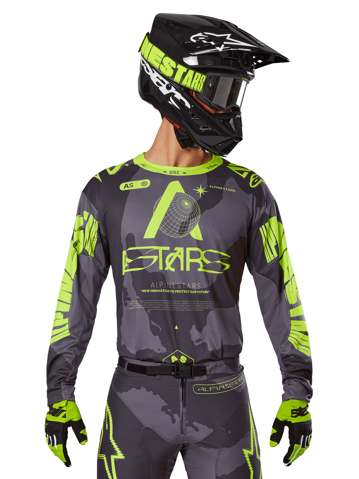 Alpinestars 2025 Racer Hollow Jersey, Motocross Racing Jersey, Dark Camo and Neon Yellow, worn with matching pants, black and yellow helmet with goggles, and black gloves, featuring Alpinestars branding and camouflage design