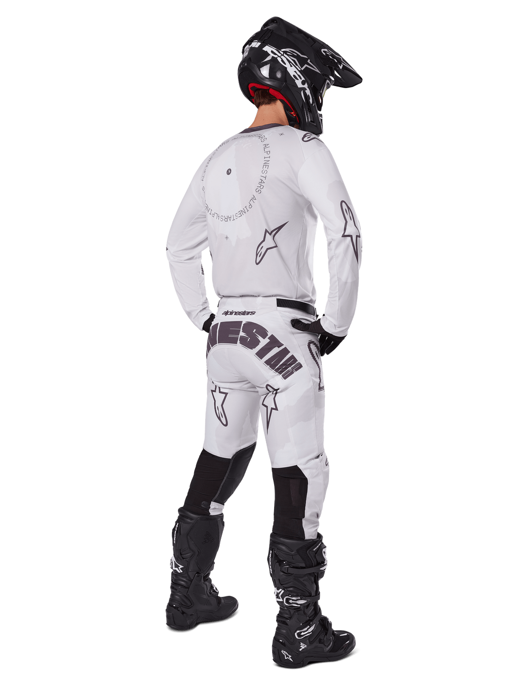Alpinestars 2025 Racer Hollow Gear Set, White, rear view of a motocross rider wearing white jersey and pants with black branding, black helmet, and black boots, coordinated professional off-road racing outfit