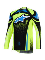 Alpinestars 2026 Techstar Nomur Jersey, Motocross Jersey, Fluo Yellow and Black with Blue accents, featuring a large blue and white Astar logo on the chest, splatter graphic details, long sleeves, athletic off-road racing gear