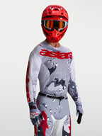 Alpinestars Racer Air Lone, camisola de motocross para homem, cinzenta camuflada e vermelha, malha respirável de alto desempenho.