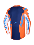 Alpinestars 2026 Fluid Grid Jersey, camisola de motocross, laranja e azul UCLA, mangas brancas com marca Alpinestars em azul, painel traseiro azul escuro com pequeno logótipo de estrela, corte traseiro mais comprido para condução em todo-o-terreno