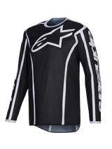 Alpinestars 2026 Fluid Apex Jersey, Motocross Jersey, Black with white accents, large white logo on chest, white trim along the seams, long-sleeve performance polyfabric for off-road racing