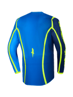 Alpinestars 2026 Fluid Apex Jersey, camisola de motocross, azul e amarelo néon, vista traseira com linhas gráficas amarelo néon e bainha traseira prolongada, equipamento de todo-o-terreno leve e respirável