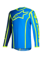Alpinestars 2026 Fluid Apex Jersey, camisola de motocross, azul e amarelo néon, logótipo de estrela grande em amarelo fluorescente no peito, mangas compridas com secções em azul-marinho e azul brilhante, logótipo vertical no braço, equipamento desportivo para todo-o-terreno