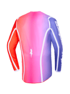 Alpinestars 2026 Fluid Apex Jersey, vista traseira, degradê multicolor rosa, roxo e laranja, com debrum curvo branco e bainha traseira alongada, vestuário profissional de motocross e off-road