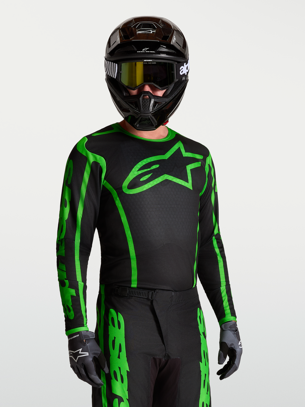 Alpinestars Camisola Fluid Apex V2, camisola de motocross para homem, preta e verde fluo, em tecido leve e respirável.