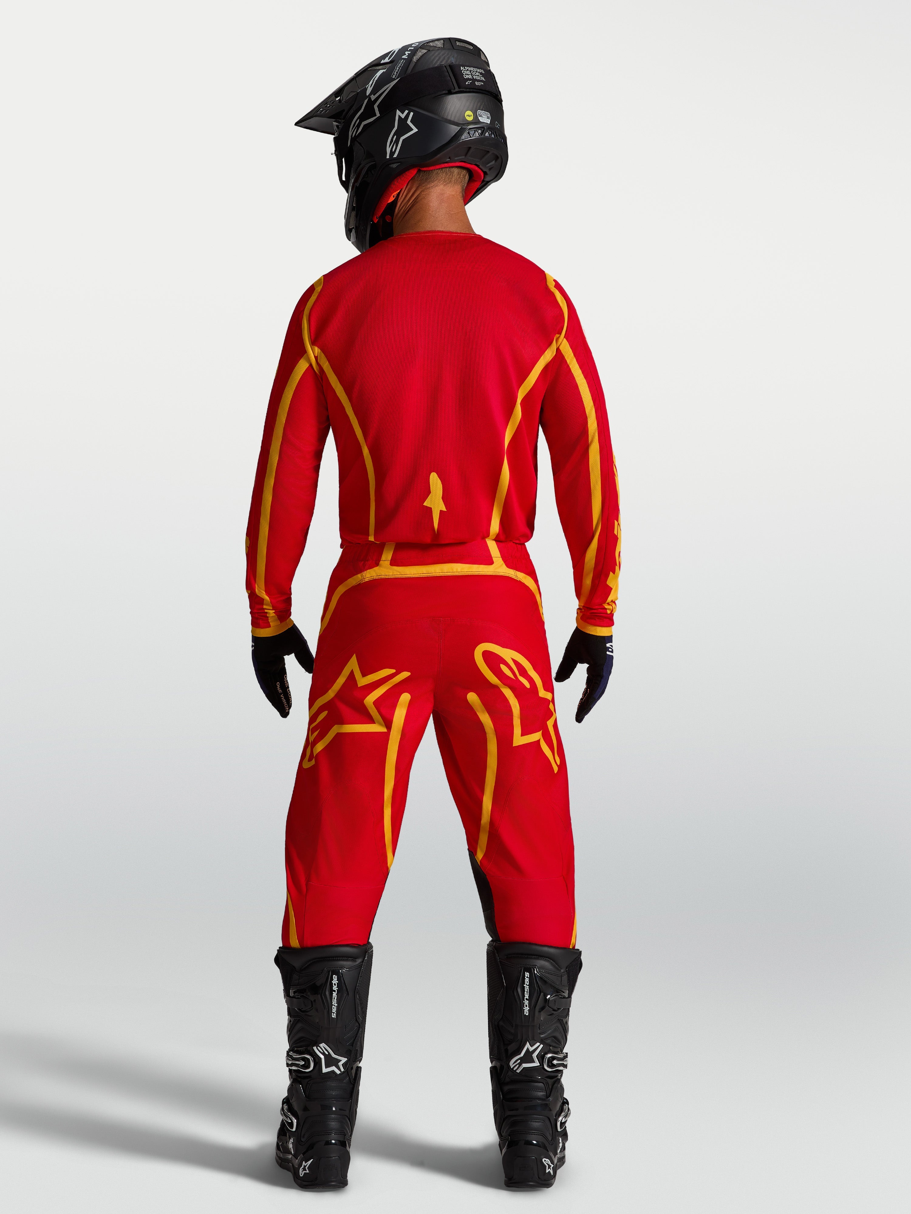 Camisola Alpinestars Fluid Apex V2 de motocross, homem, vermelha e dourada, vista traseira, material respirável.