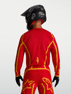 Alpinestars Fluid Apex V2, camisola de motocross para homem, vermelha e dourada, vista traseira com tecido respirável.