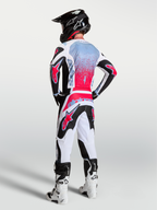 Alpinestars Fluid Drag, camisola de motocross para homem, preta e vermelha fluo, tecido respirável, vista traseira no modelo.