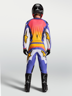 Alpinestars Camisola Fluid Drag, camisola de motocross para homem, azul e lilás com detalhes dourados, vista traseira.