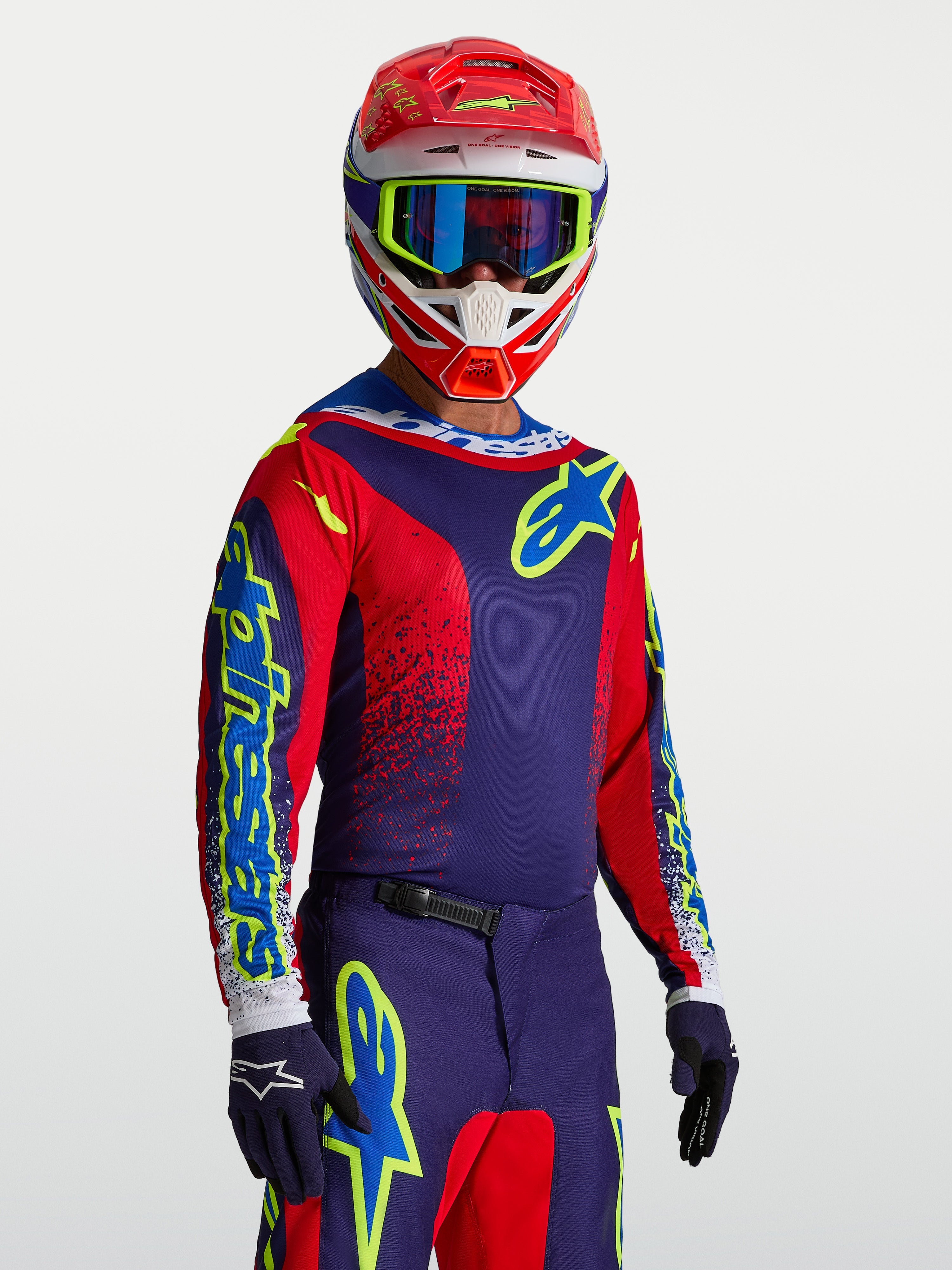 Alpinestars Camisola Fluid Drag, camisola de motocross para homem, azul-marinho e vermelha, em politecido respirável, logótipo frontal néon e ajuste desportivo.