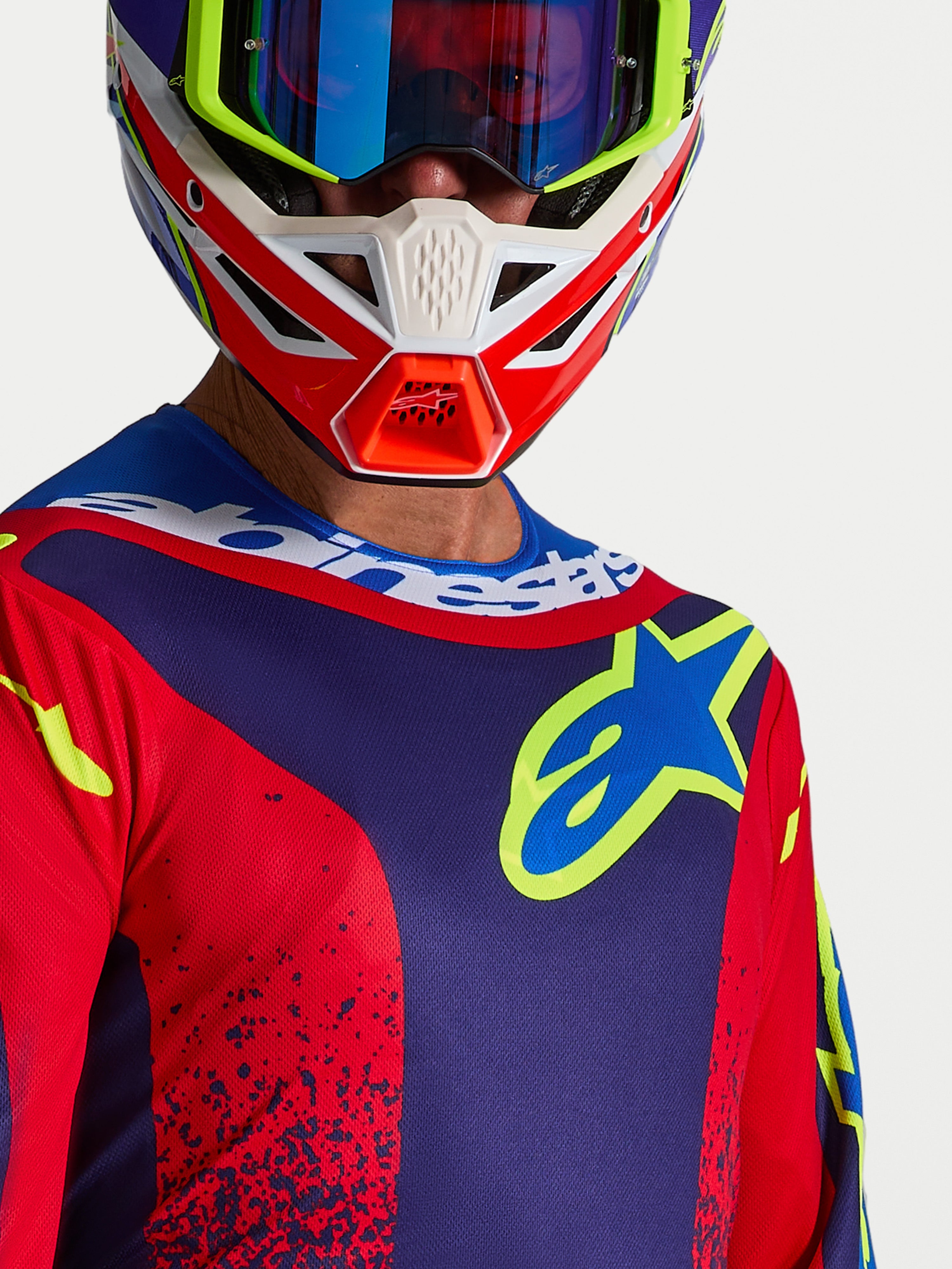 Alpinestars Fluid Drag, camisola de motocross azul marinho e vermelha para homem, com logótipo no peito e gola desportiva.
