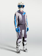 Alpinestars Fluid Drag Gear Set, conjunto de equipamento de motocross para homem, cinzento e azul, com camisola e calças.