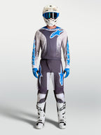 Alpinestars 2027 Fluid Drag Gear Set, conjunto de equipamento de motocross, cinzento e azul, camisola e calças de alta performance para corrida todo-o-terreno.