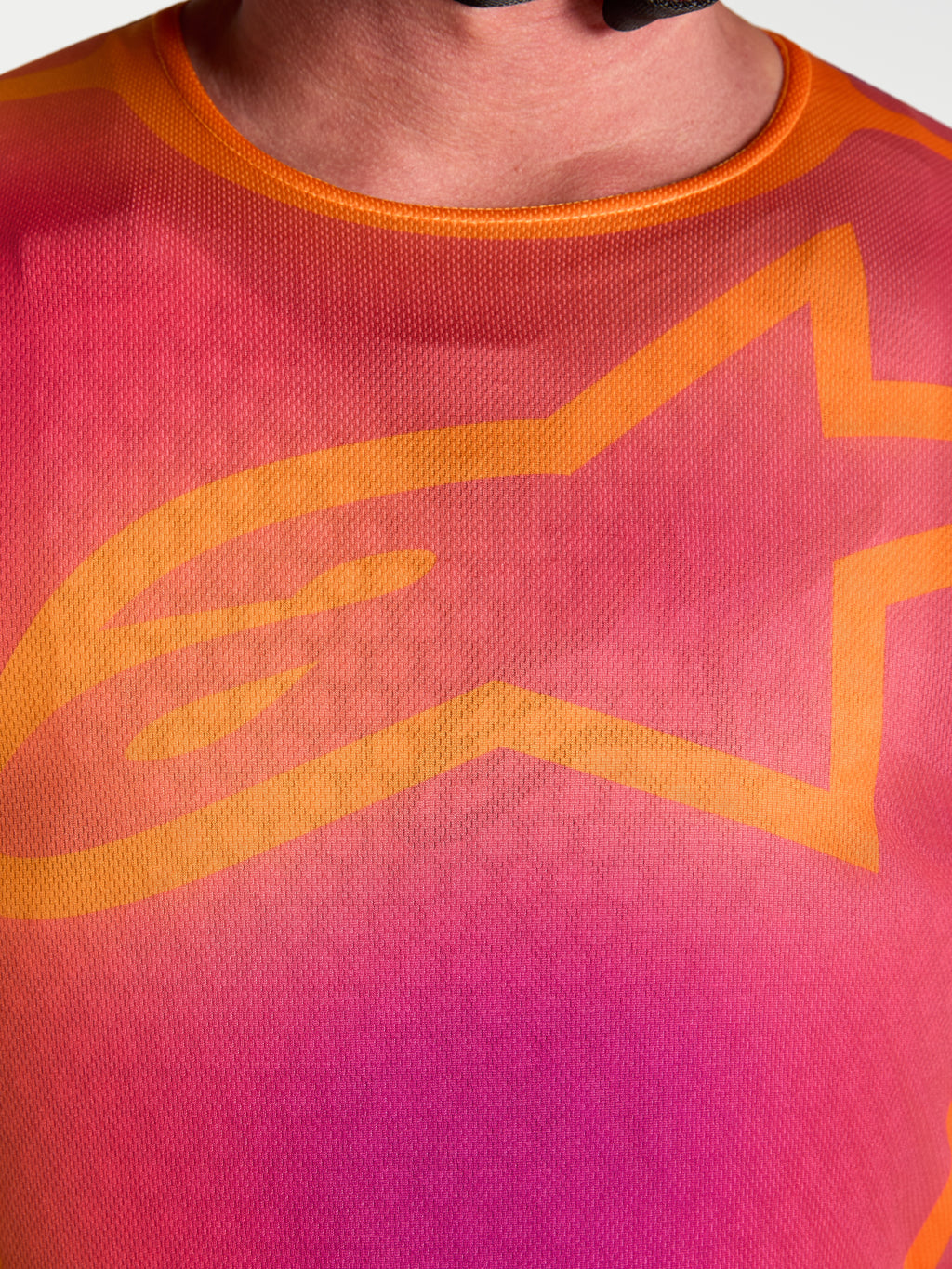 Alpinestars camisola Fluid Kepler, camisola de motocross para homem, roxo e laranja, pormenor do peito com logótipo Astars