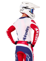 Alpinestars Limited Edition Techstar Fortitude Jersey, Motocross Jersey, Bright Red White and Blue, back view on a rider wearing a white helmet and matching gear, featuring bold Alpinestars logos on the back and sleeves, designed for high-performance off-road racing.