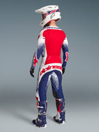 Alpinestars Techstar Unity Jersey edição limitada, camisola de motocross vermelha, branca e azul, vista traseira ventilada.