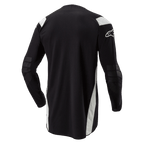 Alpinestars Techdura Jersey, Enduro Motocross Jersey, Black with white accents, rear view featuring an elongated drop tail, reinforced elbows, and white Alpinestars logo on the sleeve, durable off-road riding apparel.