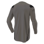 Camisola Alpinestars Techdura, Falcon Brown, camisola de motocross, vista traseira mostrando a parte traseira alongada para maior cobertura, mangas compridas com secções reforçadas nos cotovelos, painéis pretos nos ombros e logótipo na manga, vestuário durável para todo-o-terreno