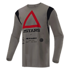 Camisola Alpinestars Techdura, camisola de motocross e enduro, Falcon Brown, com um grande triângulo vermelho no peito e marca ASTARS a preto, detalhes pretos nos ombros, tecido técnico de poliéster para desempenho em todo-o-terreno