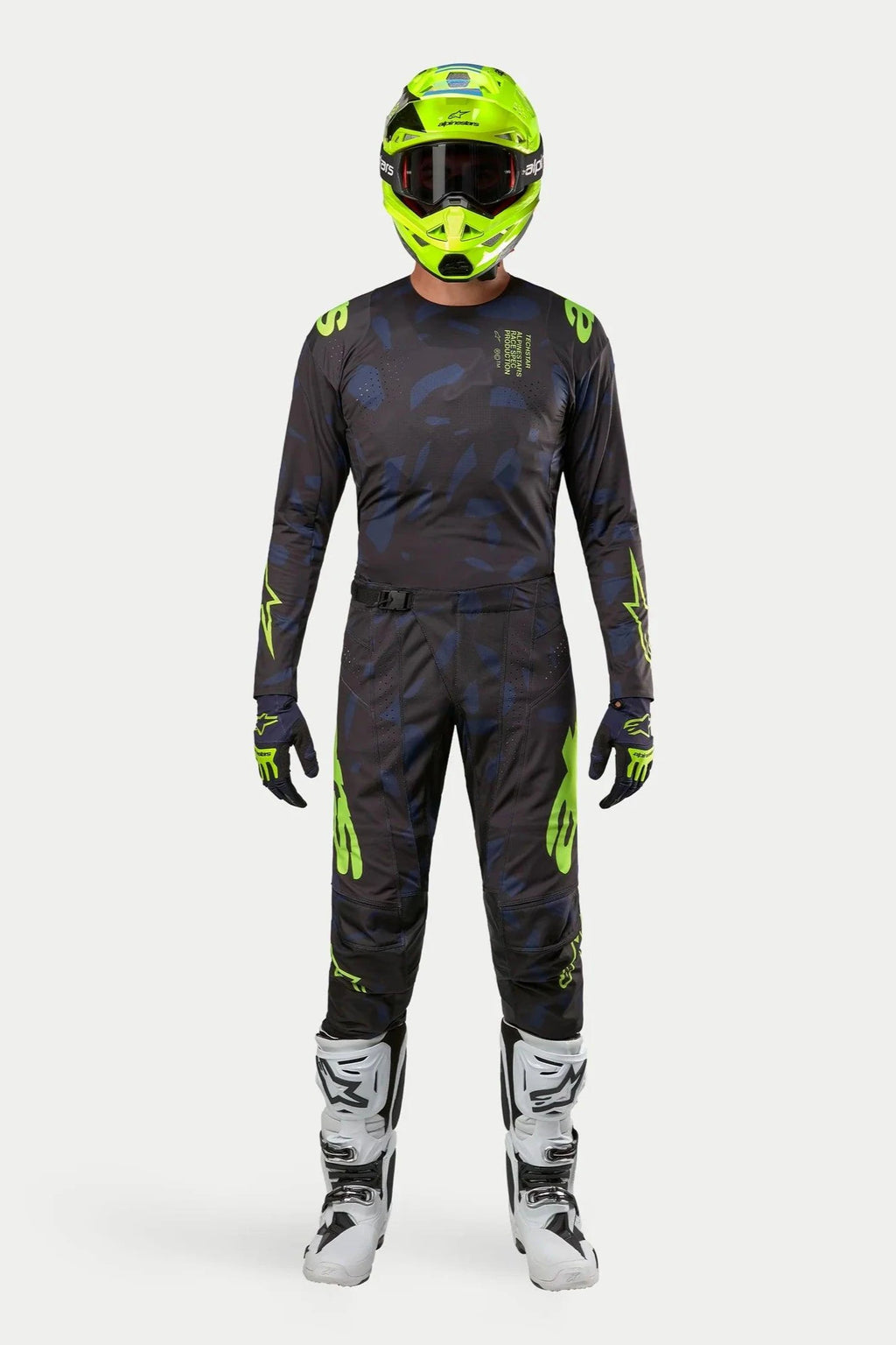 Alpinestars 2024 Techstar Rantera Jersey and Pants, Motocross racing gear set, Black Navy and Yellow Fluo, worn with a matching fluorescent yellow helmet and white boots, featuring bold yellow branding and technical mesh panels for off-road performance