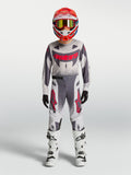 Alpinestars Supertech Swan 2027 para jovens, conjunto de motocross cinzento e branco com pormenores vermelhos.