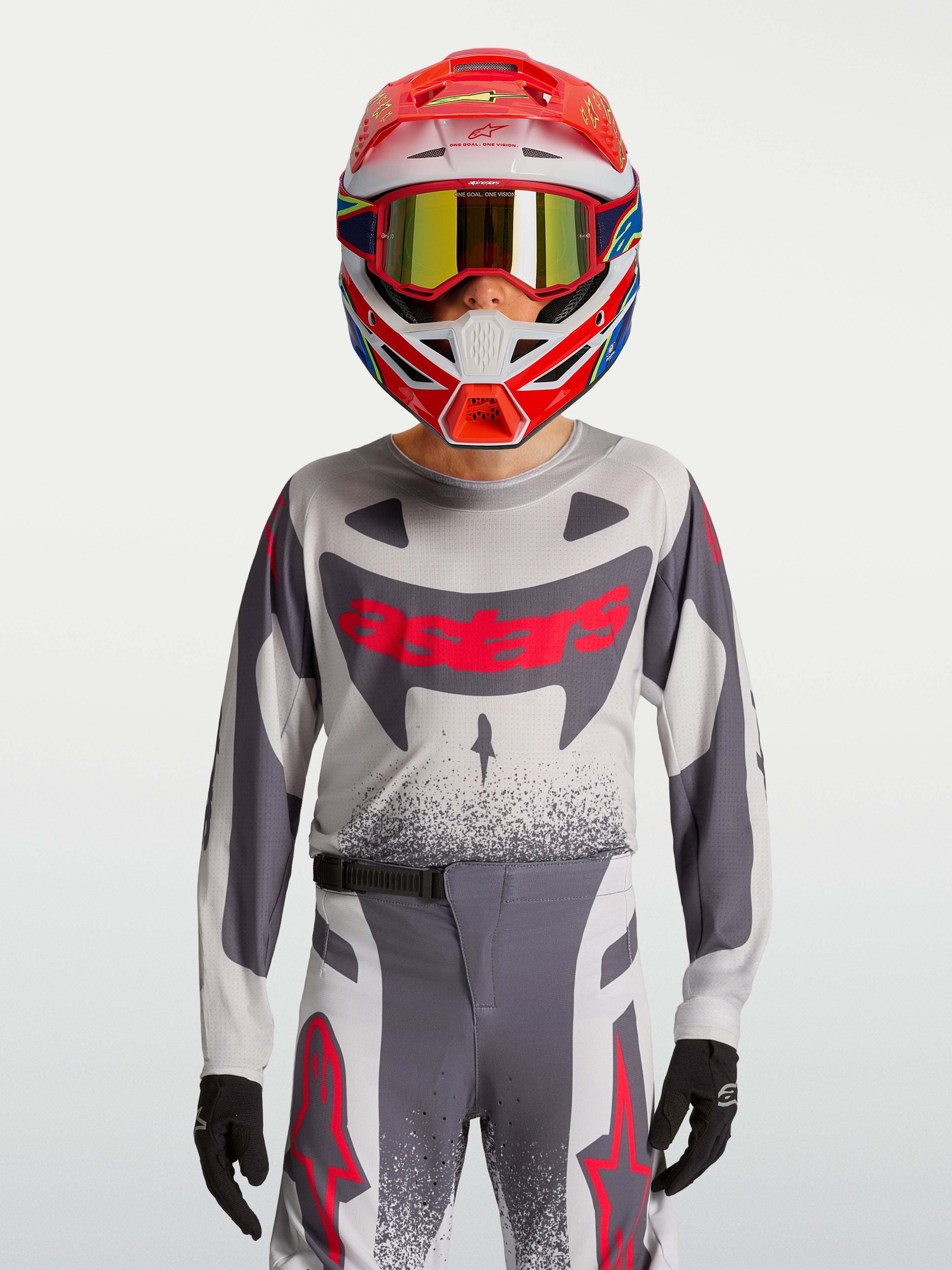 Alpinestars Youth Supertech Swan Jersey and Gear Set, conjunto de motocross em malha elástica, cinzento e vermelho fluo.
