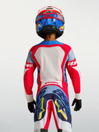 Alpinestars Supertech Dyna Jovem 2027, camisola de motocross vermelha e azul-marinho, vista traseira, malha elástica leve.
