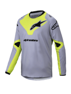 Alpinestars 2025 Youth Racer Veil Jersey, camisola de motocross de manga comprida para jovens, cinzenta e amarelo néon com logótipos pretos, gola e punhos pretos, tecido leve e respirável, design geométrico