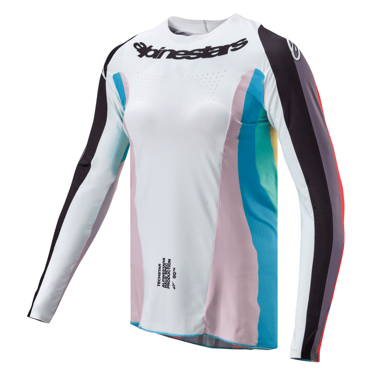 Camisola Alpinestars Stella Techstar 2024 para Mulher, camisola de motocross, preto multicor, corpo branco com painéis laterais cor-de-rosa e azul-turquesa, mangas com riscas pretas, logótipo Alpinestars no peito, corte atlético feminino com perfurações de ventilação
