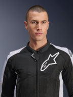 Male model wearing the Alpinestars Viper Air V4 Jacket in Black and White, featuring tech mesh panels for airflow, white Alpinestars star logo on the chest, sporty motorcycle road gear