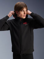 Alpinestars MM93 Radium Tech Hoodie, urban motorcycle jacket, black with red and silver logos, worn by a male model, features a full-length zipper and ribbed cuffs, casual lifestyle motorsport apparel