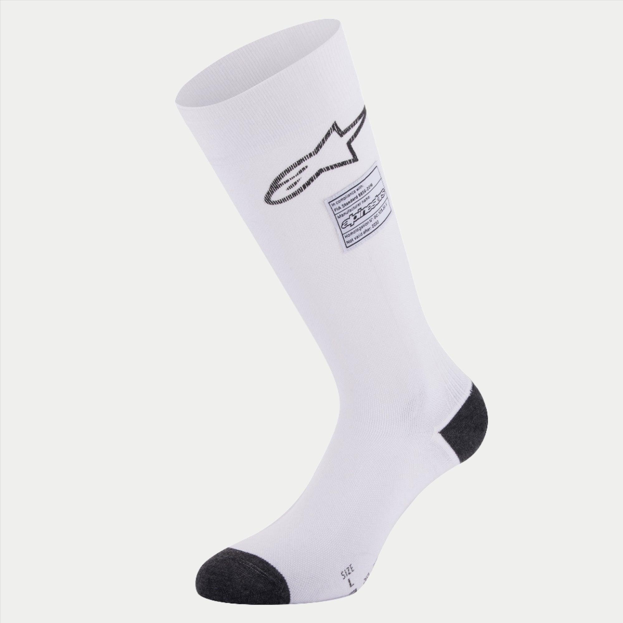Meias Alpinestars ZX V4, meias de automobilismo, brancas com detalhes pretos no calcanhar e na biqueira, com logótipo Alpinestars preto e etiqueta de conformidade FIA, camada de base técnica sem costuras para desportos motorizados
