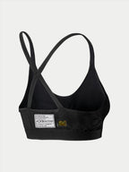 Alpinestars Stella TECH ZX Bra, Auto Racing Base Layer, Black, back view featuring FIA 8856-2018 certification label, thin crossed straps, lightweight flame-resistant material for motorsport protection.