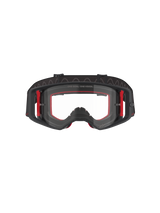 Alpinestars Supertech Corp Goggles, óculos de motocross, pretos, vermelhos e transparentes, vista frontal, lente transparente com o texto 'ONE GOAL. ONE VISION.', armação preta com detalhes laterais vermelhos, amplo campo de visão, correia durável com aderência de silicone ondulado