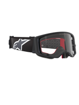 Óculos Alpinestars Supertech Corp, óculos de motocross, pretos, cinzentos e transparentes, com lente de policarbonato transparente, correia preta larga com logótipo Astars em cinzento e branco, espuma facial moldada em 3D, proteção ocular de alta performance para corridas off-road