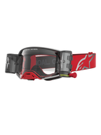 Alpinestars Supertech Firma Roll Off, óculos de motocross vermelhos e prateados com sistema roll-off e lentes transparentes.