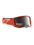 Alpinestars Supertech Vesta, óculos de motocross laranja com lente prateada espelhada e alça com logótipo de estrela branco.