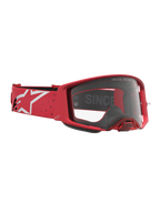 Alpinestars Supertech Vesta, óculos de motocross vermelhos e brancos, com lente transparente e fita com logótipo Astars.