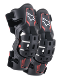 Alpinestars Youth Bionic 5S Knee Braces, Motocross Knee Protection, Black and Red, pair of protectors featuring a hybrid frame design with ventilated shells, white Astar logo on the upper section, red ASTARS branding on the lower section, and adjustable black straps for a secure fit.