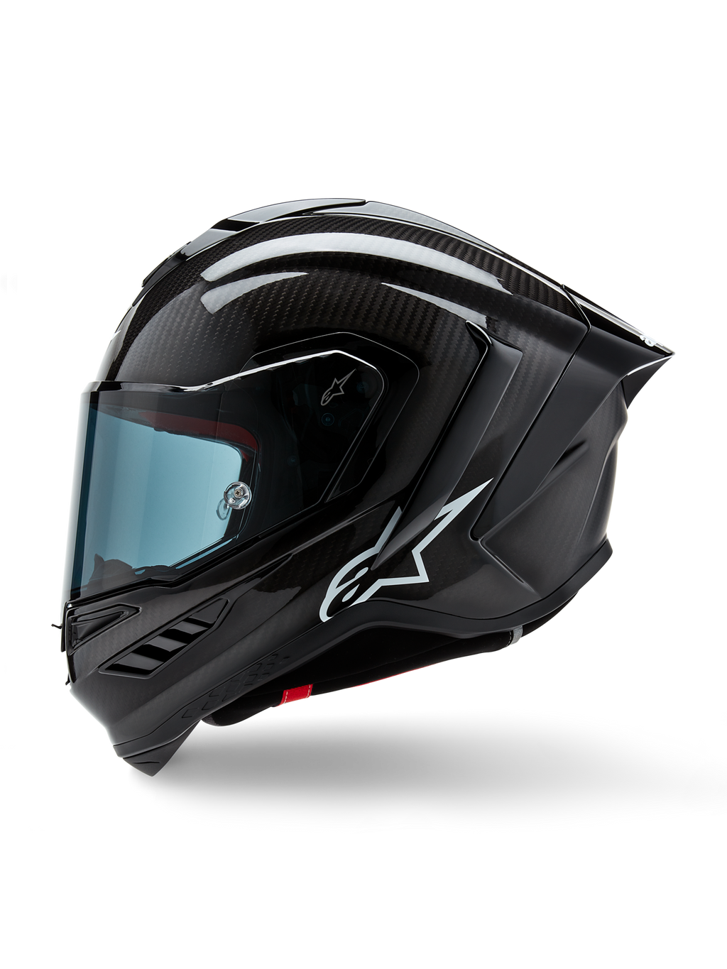 Capacete Alpinestars Supertech R10 Solid, capacete integral de corrida para motociclismo, carbono preto mate e brilhante, padrão de fibra de carbono visível, logótipo Alpinestars branco na lateral, design aerodinâmico com spoiler traseiro integrado e aberturas de ventilação, vista de perfil lateral
