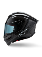 Capacete Alpinestars Supertech R10 Solid, capacete integral de corrida para motociclismo, carbono preto mate e brilhante, padrão de fibra de carbono visível, logótipo Alpinestars branco na lateral, design aerodinâmico com spoiler traseiro integrado e aberturas de ventilação, vista de perfil lateral