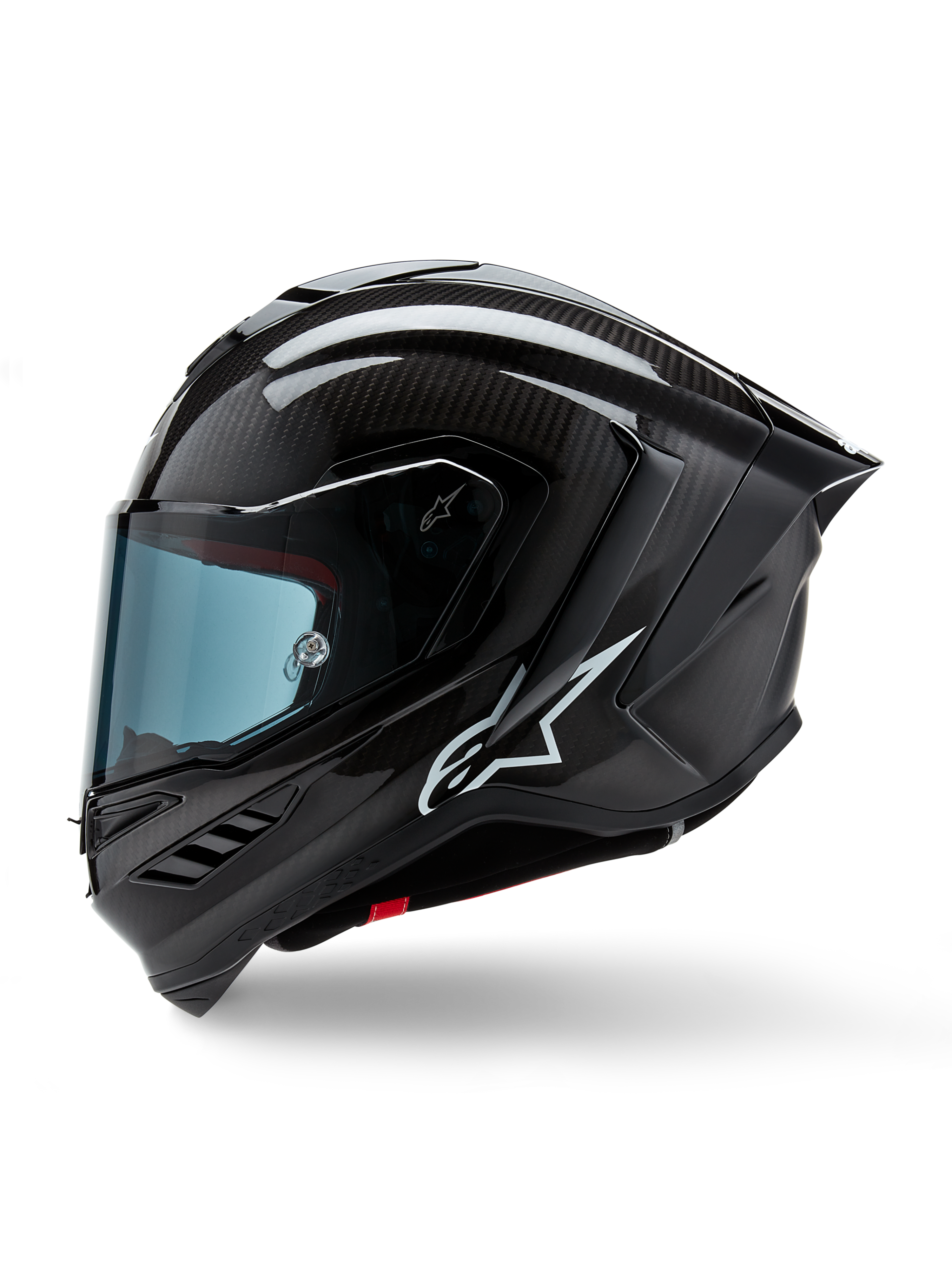 Capacete Alpinestars Supertech R10 Solid, capacete integral de corrida para motociclismo, carbono preto mate e brilhante, padrão de fibra de carbono visível, logótipo Alpinestars branco na lateral, design aerodinâmico com spoiler traseiro integrado e aberturas de ventilação, vista de perfil lateral