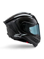 Alpinestars Supertech R10 Solid Helmet, capacete de corrida em fibra de carbono, preto mate e brilhante, perfil lateral, viseira com tonalidade azul, design aerodinâmico com winglets, logótipo branco, proteção de alto desempenho de nível MotoGP