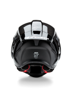 Capacete Alpinestars Supertech R10 Solid, capacete de motociclismo, Preto Carbono Mate e Brilhante, vista traseira com textura de fibra de carbono, spoiler aerodinâmico com logótipo Alpinestars branco, selos de certificação de segurança DOT e ECE, e forro interior vermelho