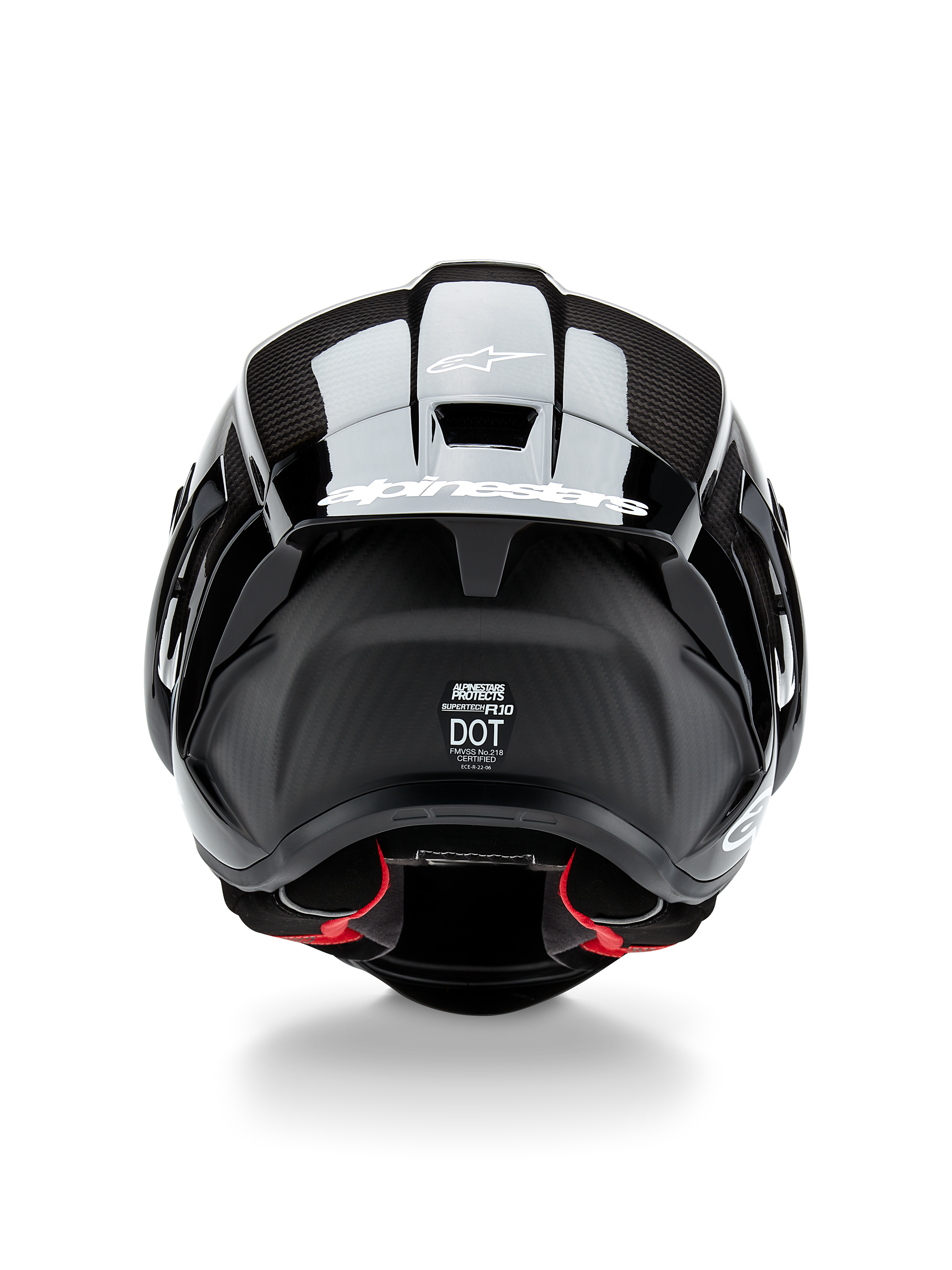 Capacete Alpinestars Supertech R10 Solid, capacete de motociclismo, Preto Carbono Mate e Brilhante, vista traseira com textura de fibra de carbono, spoiler aerodinâmico com logótipo Alpinestars branco, selos de certificação de segurança DOT e ECE, e forro interior vermelho