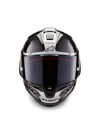 Alpinestars Supertech R10 Element Helmet, Full-Face Racing Helmet, Black Carbon Silver Black Glossy, front view showing dark smoke visor and glossy carbon fiber weave with silver aerodynamic graphics and Alpinestars logos