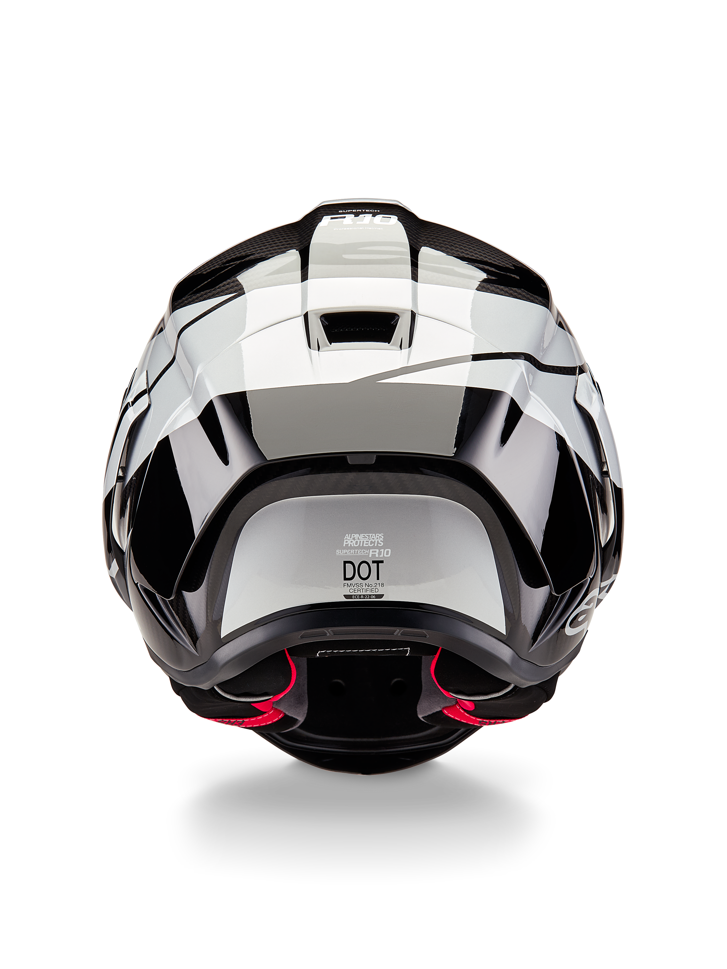 Alpinestars Supertech R10 Element Helmet, Rear View, Black Carbon Silver Black Glossy, featuring aerodynamic spoiler design, DOT certification label, and red interior padding accents, professional racing head protection
