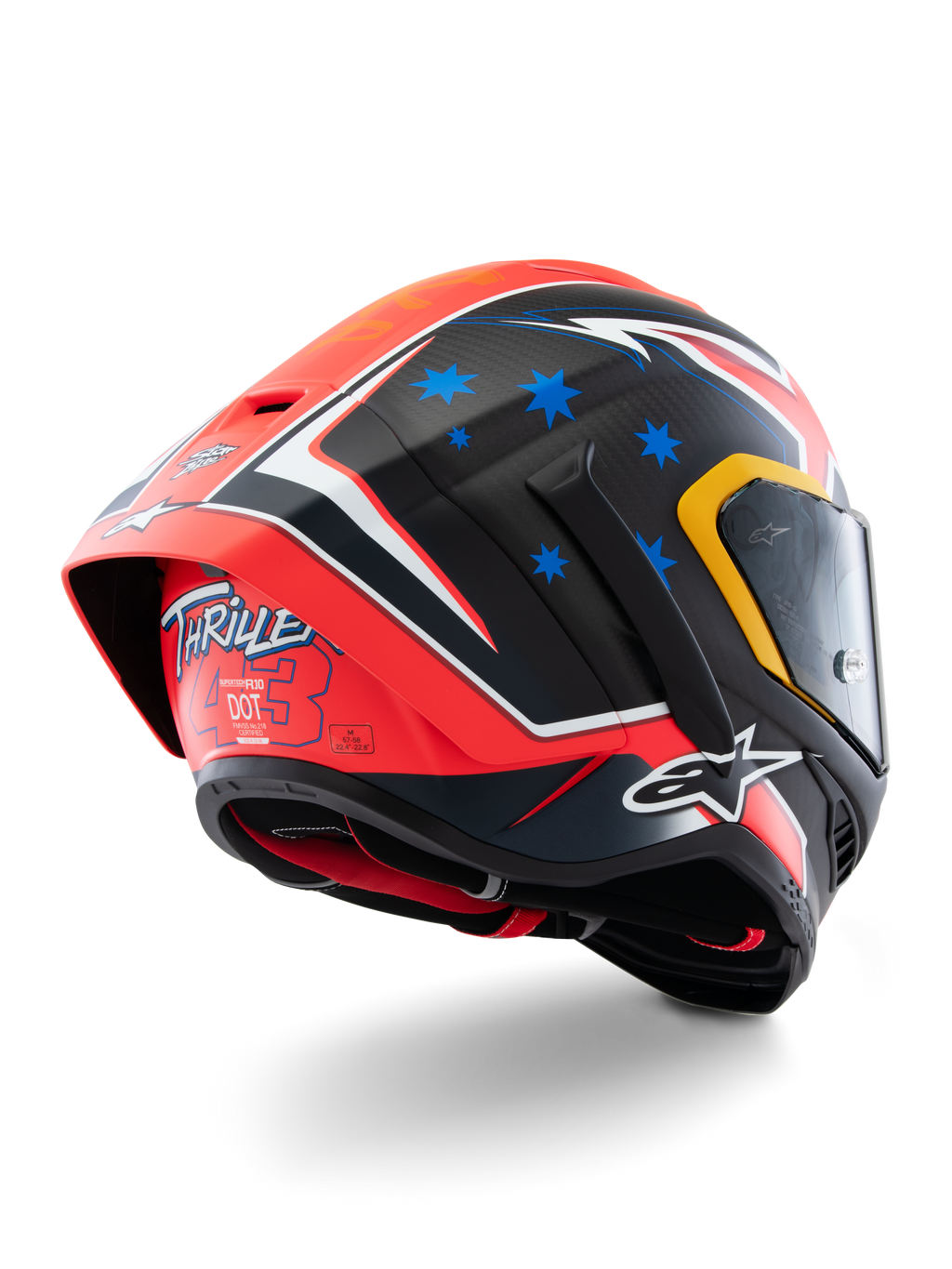 Capacete Alpinestars Supertech R10 Miller Limited Edition, capacete de corrida integral, Carbon Red Matt com estrelas azuis e detalhes brancos, grafismo 'Thriller 43' na parte traseira, spoiler aerodinâmico de grandes dimensões, construção em fibra de carbono
